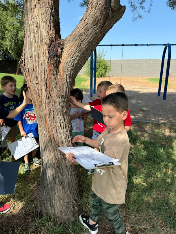 EDUPRIZE students exploring a school garden as part of an outdoor science lesson.